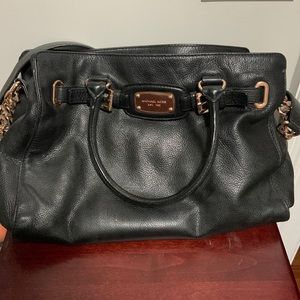 Michael Kors Purse. This is a medium size bag hold a lot. Has multiple pockets